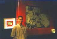 George poses next to The Biggest Etch-A-Sketch Artwork in the World